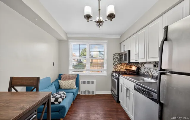 a kitchen with stainless steel appliances granite countertop a stove a sink dishwasher and a refrigerator