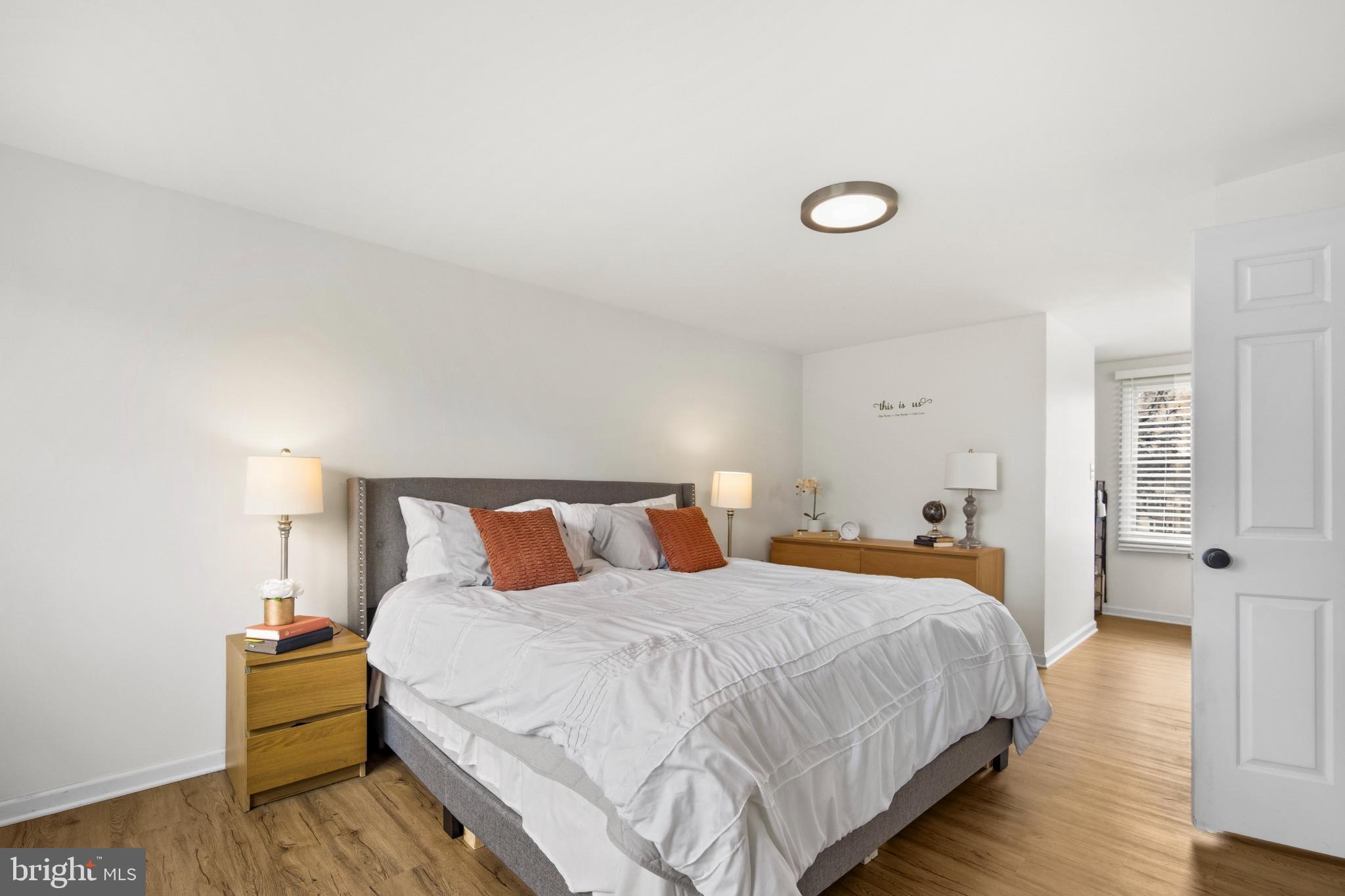 1811 Rustic Hill Court Frederick, MD 21702 - Photo 16 of 48 a bedroom with a bed and wooden floor