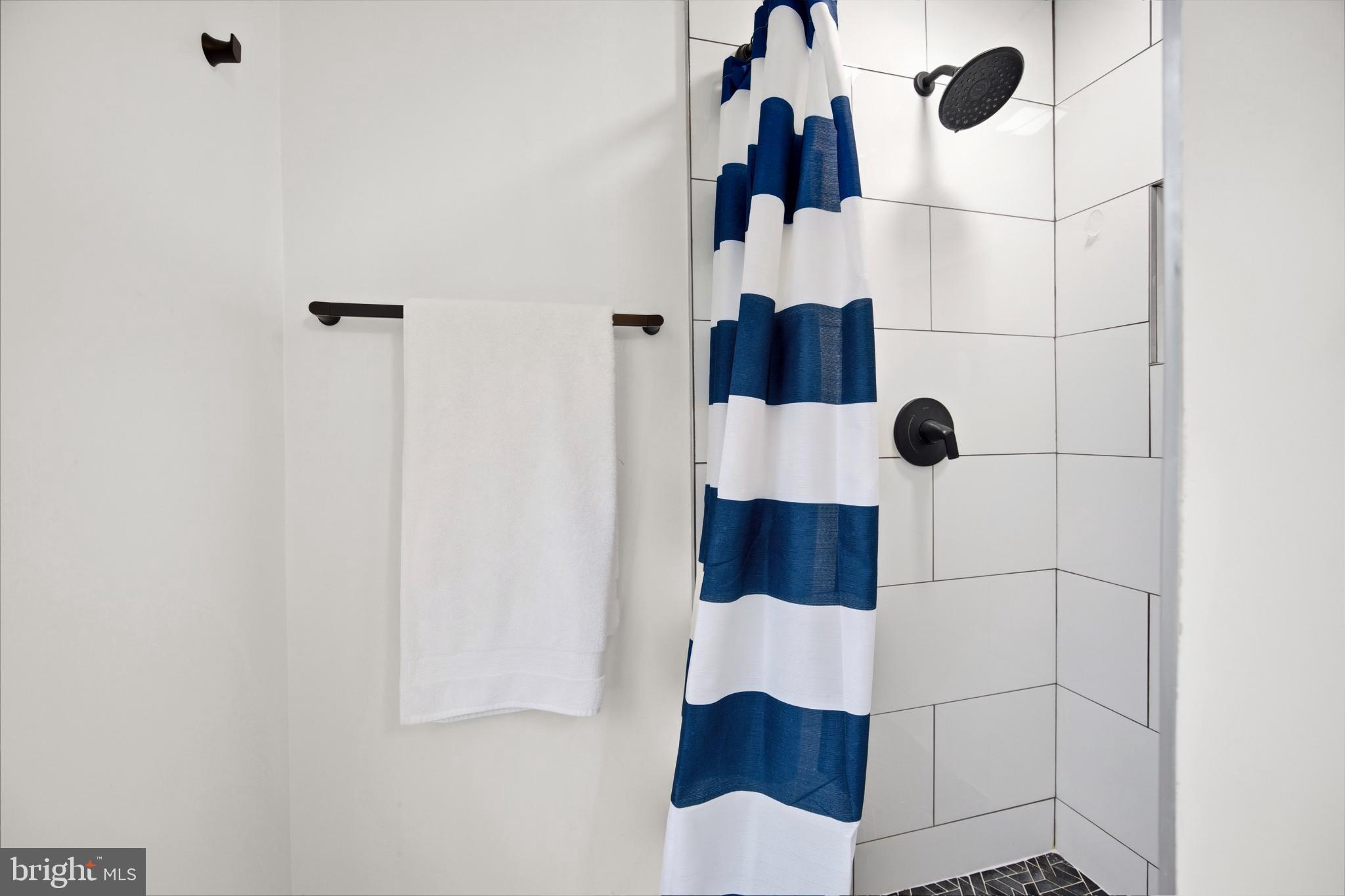 1811 Rustic Hill Court Frederick, MD 21702 - Photo 20 of 48 a bathroom with a shower and a mirror