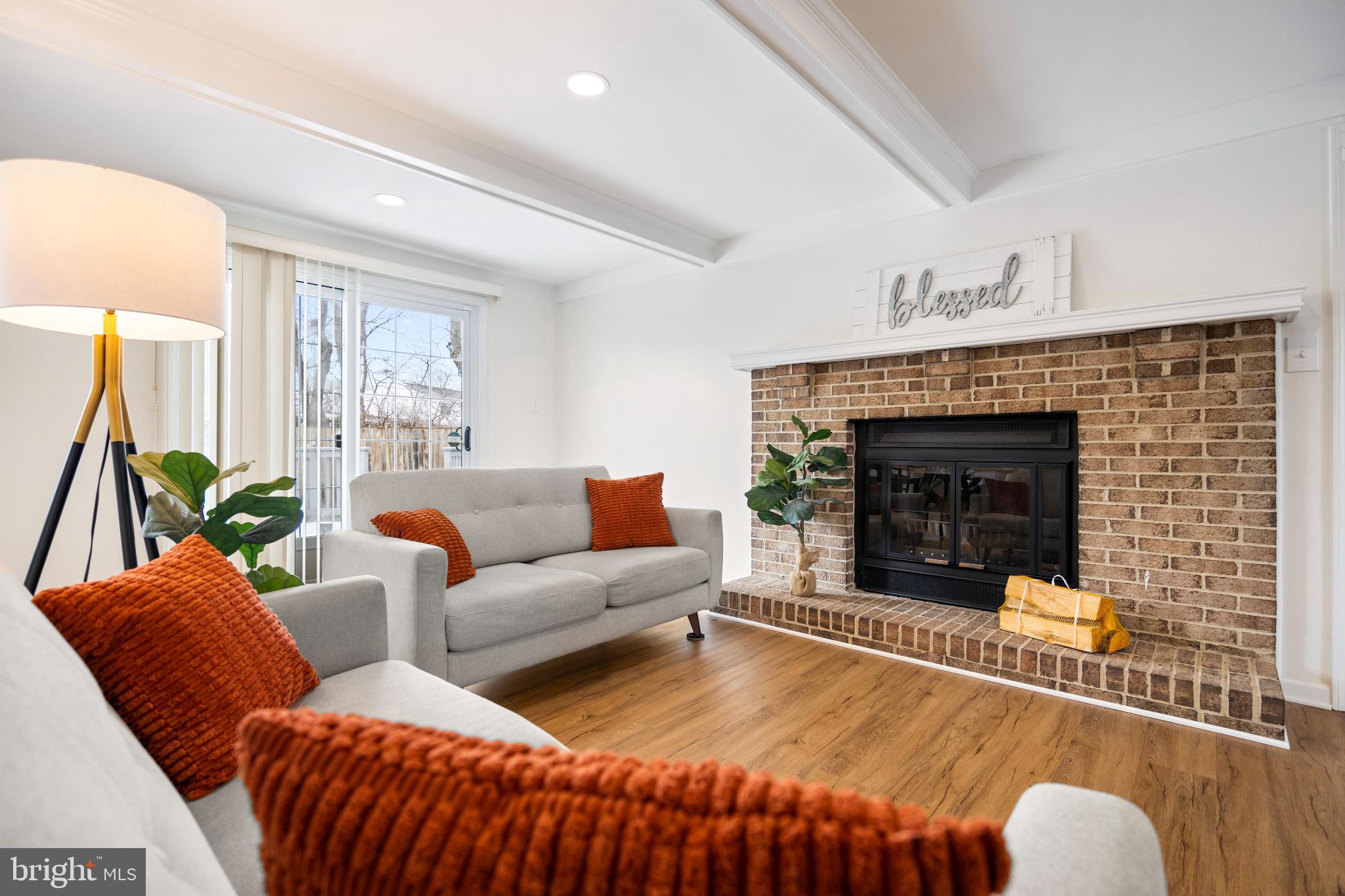 1811 Rustic Hill Court Frederick, MD 21702 - Photo 2 of 48 a living room with furniture and a fireplace