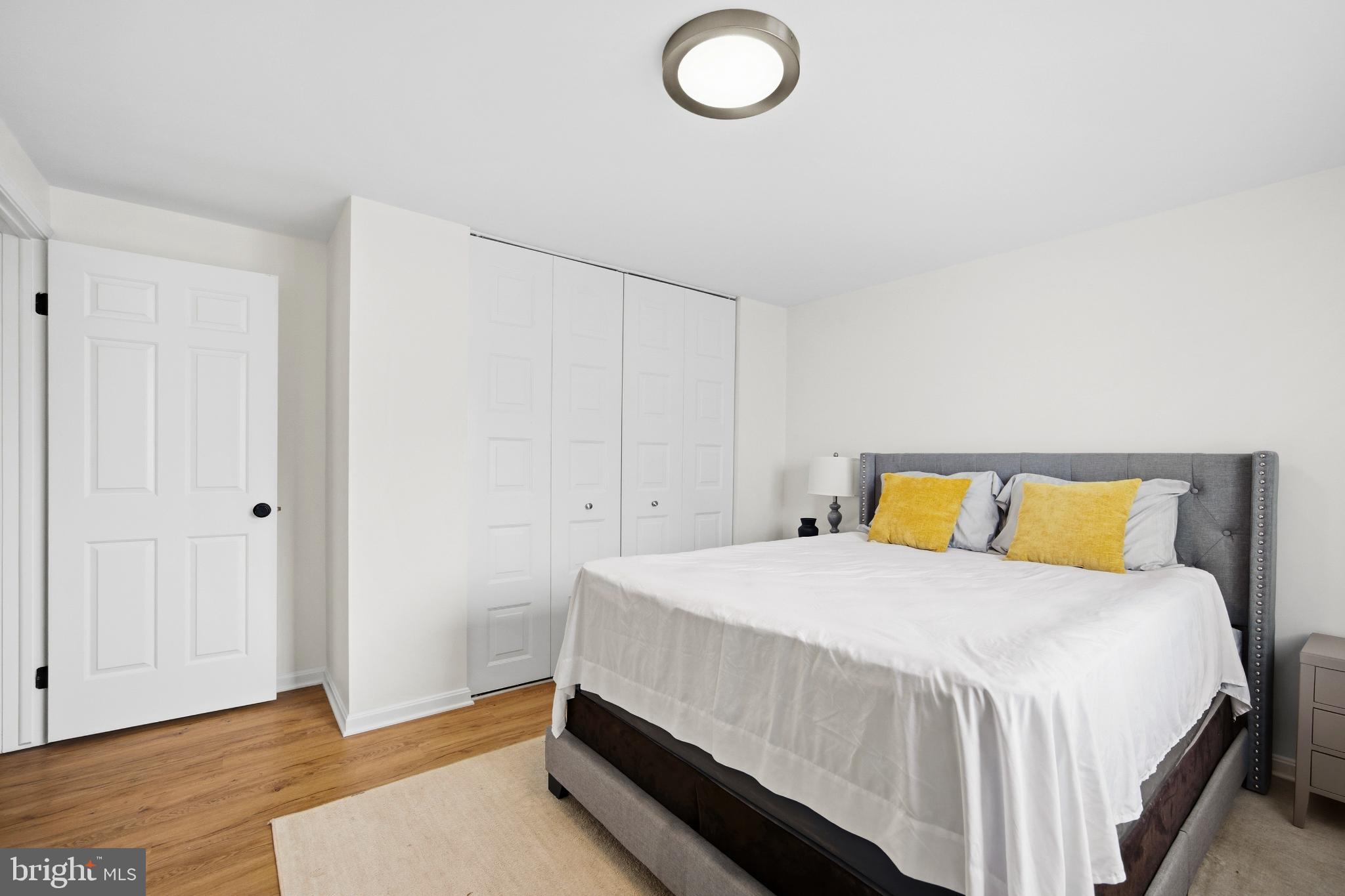 1811 Rustic Hill Court Frederick, MD 21702 - Photo 22 of 48 a bedroom with a bed and wooden floor