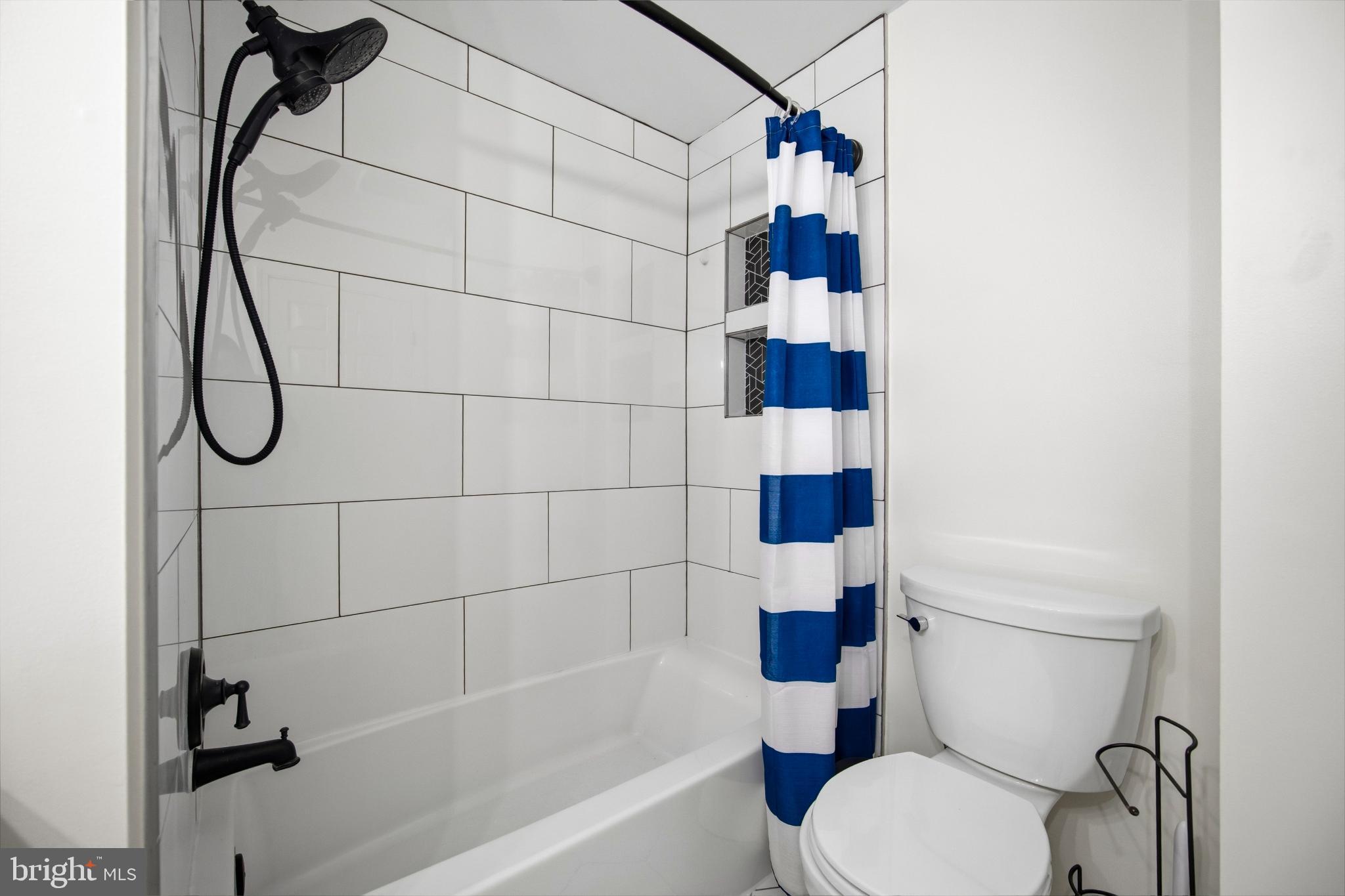 1811 Rustic Hill Court Frederick, MD 21702 - Photo 24 of 48 a bathroom with a toilet and a shower