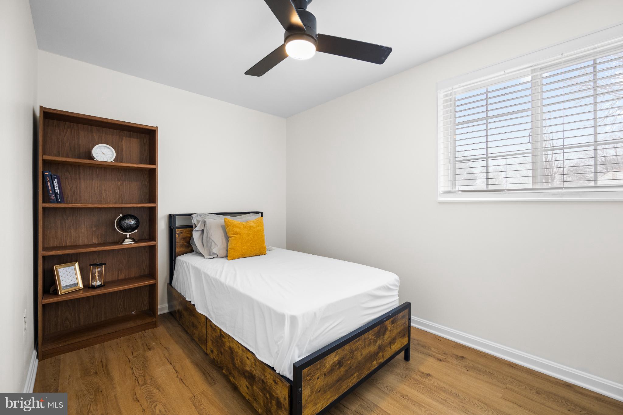 1811 Rustic Hill Court Frederick, MD 21702 - Photo 26 of 48 a bed sitting in a bedroom next to a window