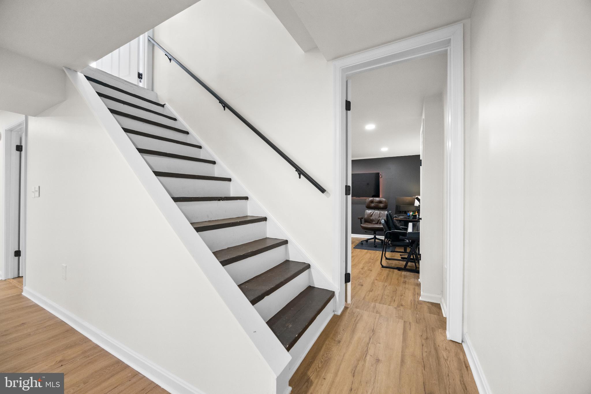 1811 Rustic Hill Court Frederick, MD 21702 - Photo 31 of 48 a view of entryway and hall with wooden floor