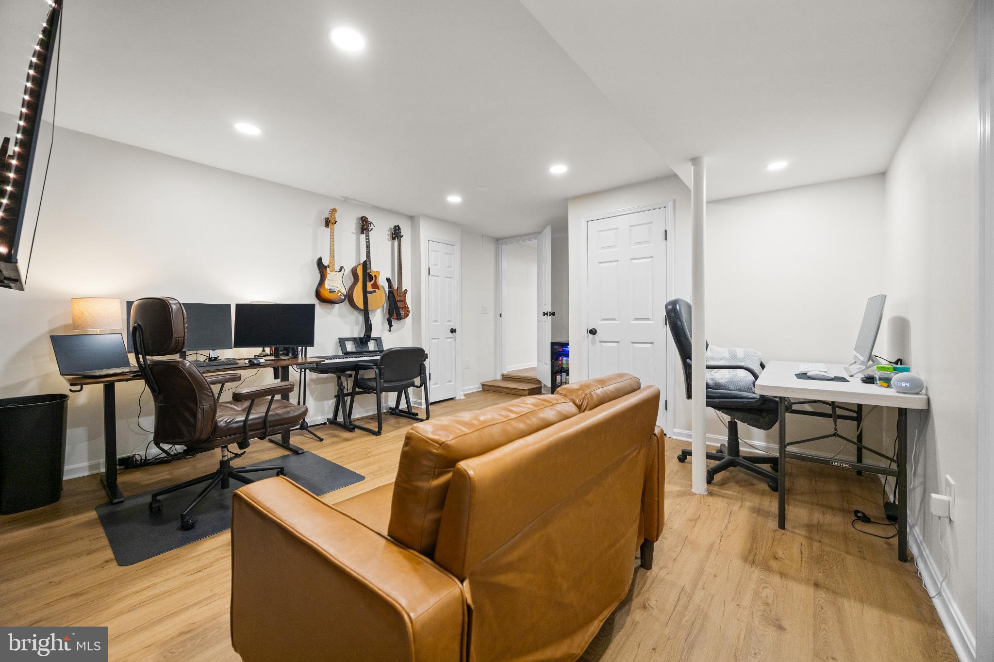 1811 Rustic Hill Court Frederick, MD 21702 - Photo 33 of 48 a living room with furniture flat screen tv and wooden floor