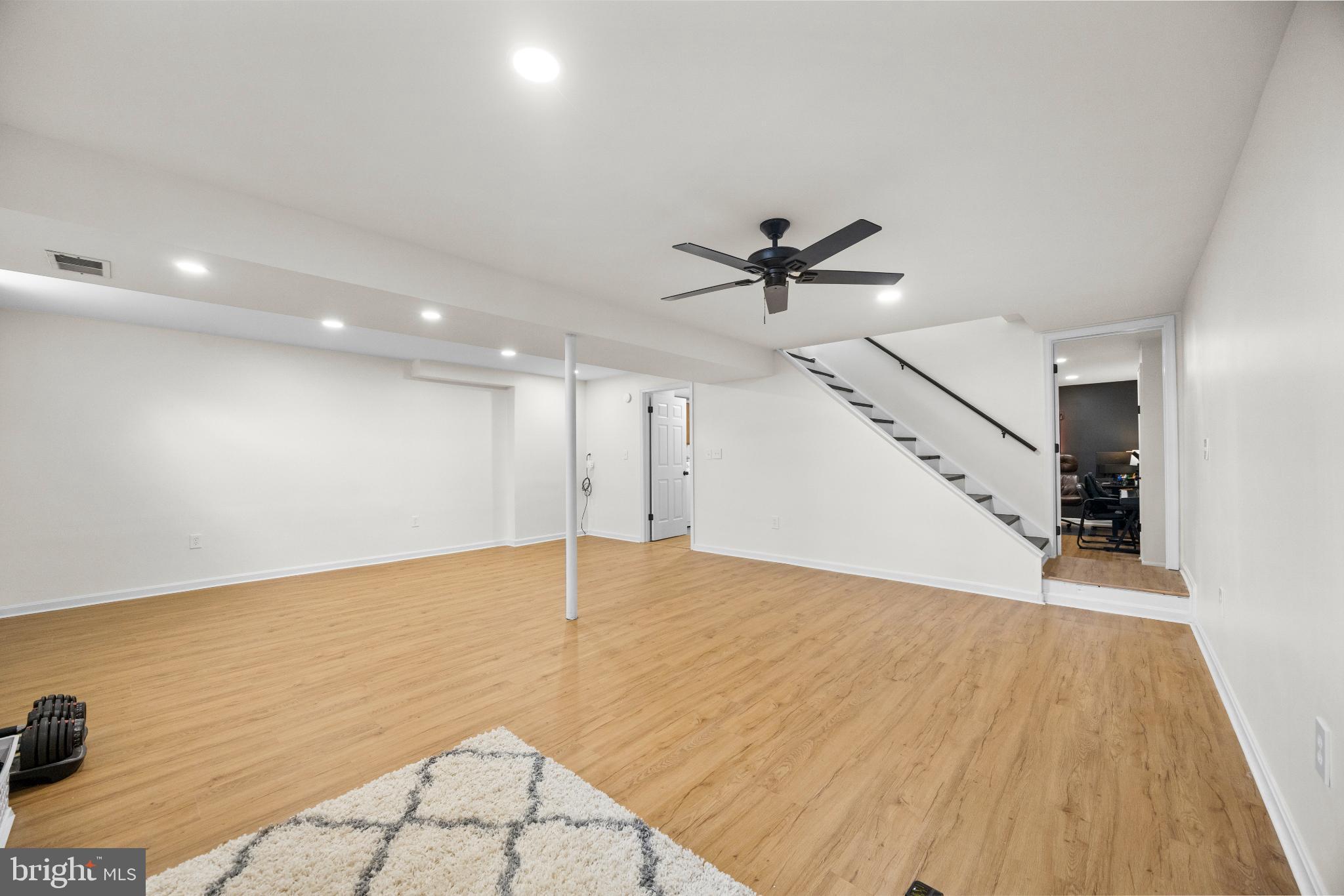 1811 Rustic Hill Court Frederick, MD 21702 - Photo 34 of 48 a view of an empty room and wooden floor