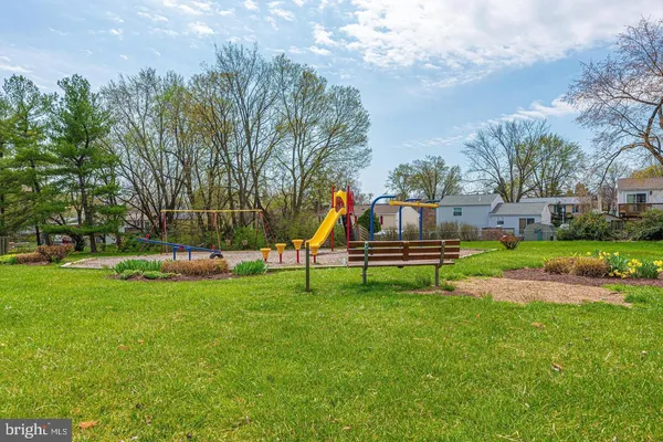 a garden with wooden fence