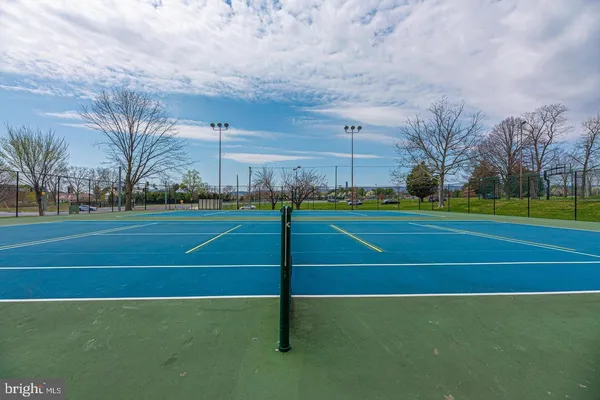 a view of an outdoor space and tennis court