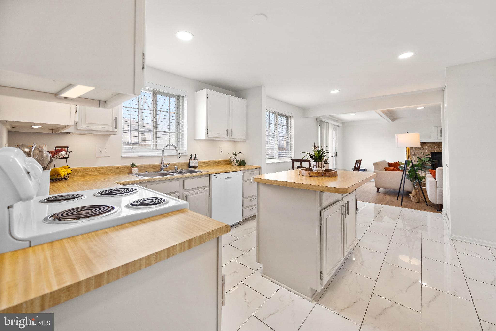 1811 Rustic Hill Court Frederick, MD 21702 - Photo 8 of 48 a kitchen with stainless steel appliances granite countertop a sink cabinets and a counter top space