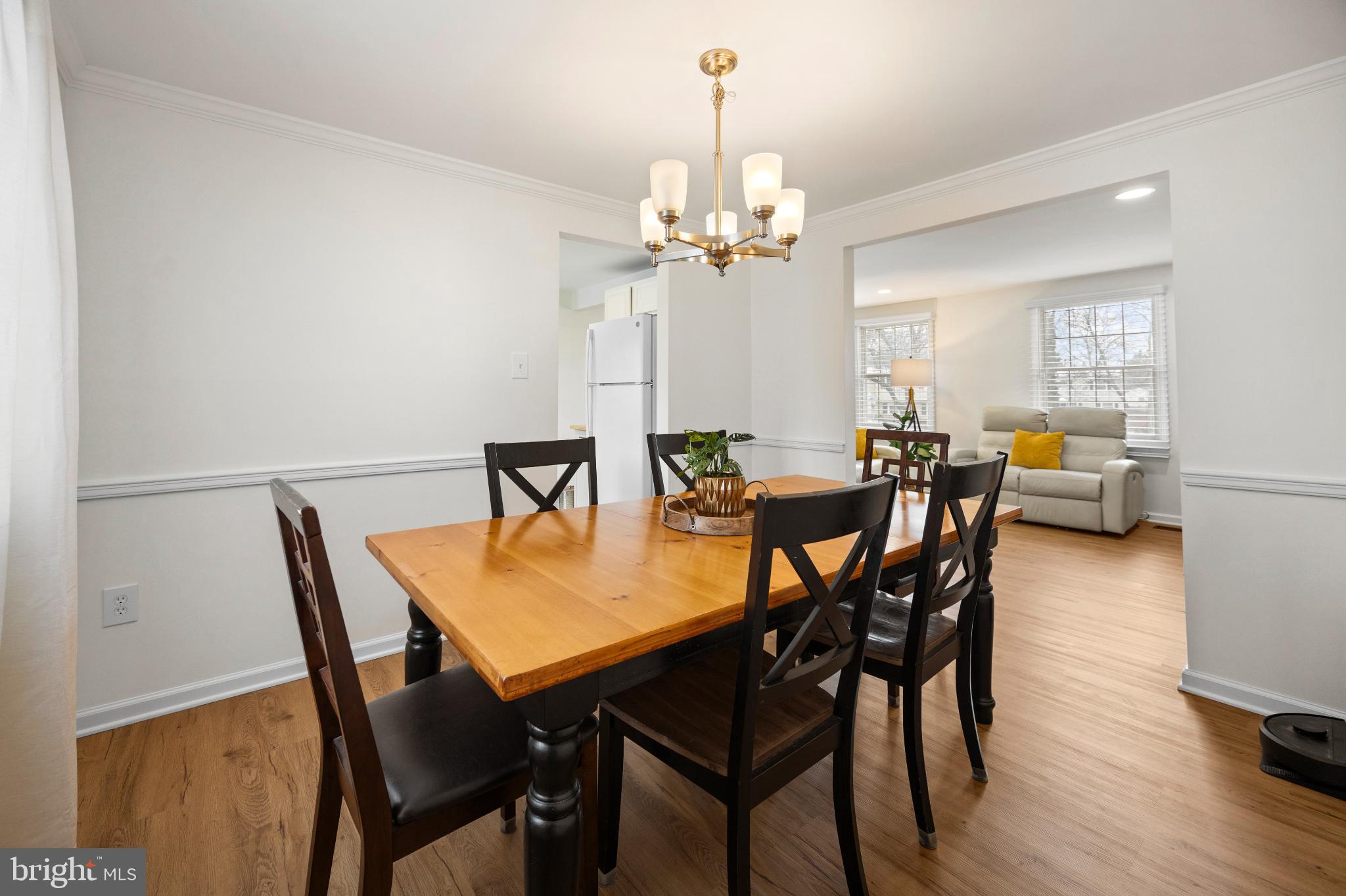 1811 Rustic Hill Court Frederick, MD 21702 - Photo 9 of 48 a view of a dining room with furniture and wooden floor