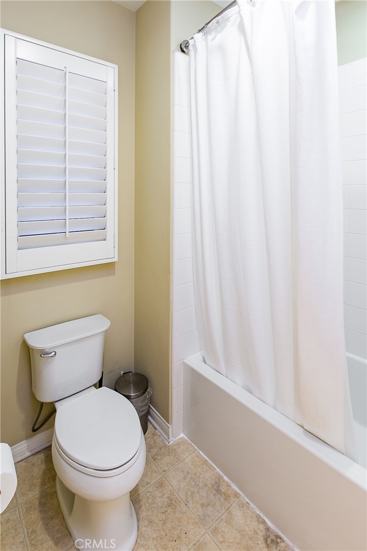 75 Gardenstone Path Irvine, CA 92620 - Photo 35 of 65 a white toilet sitting next to a window