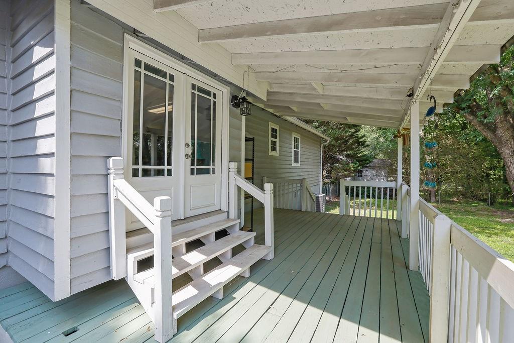 1555 Rock Springs Road Buford, GA 30519 - Photo 23 of 27 a view of balcony with deck and wooden floor