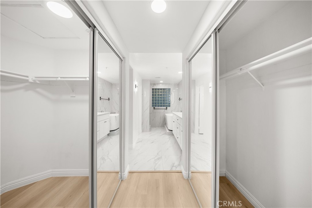 2253 Martin, Unit 106 Irvine, CA 92612 - Photo 5 of 19 a bathroom with a glass shower door and a bathtub