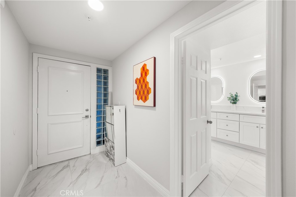 2253 Martin, Unit 106 Irvine, CA 92612 - Photo 6 of 19 a view of walk in closet with wooden floor