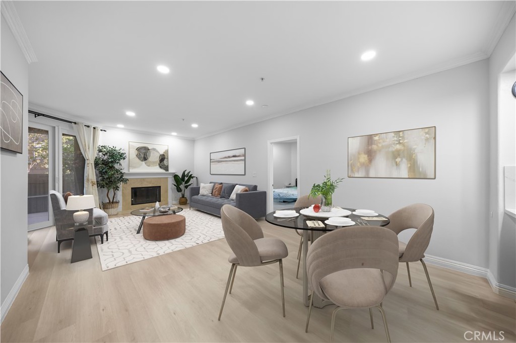 2253 Martin, Unit 106 Irvine, CA 92612 - Photo 10 of 19 a living room with fireplace furniture and a wooden floor