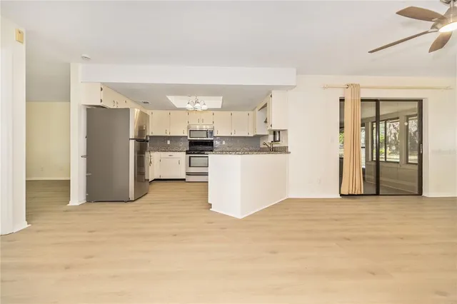 a view of a kitchen with a sink