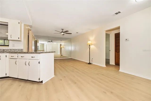 a view of a kitchen with granite countertop cabinets and a sink