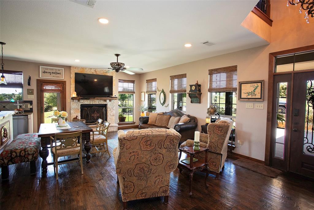7060 Hells Gate Loop Strawn, TX 76475 - Photo 20 of 40 Living room with plenty of natural light, a ceiling fan, wood-type flooring, and recessed lighting