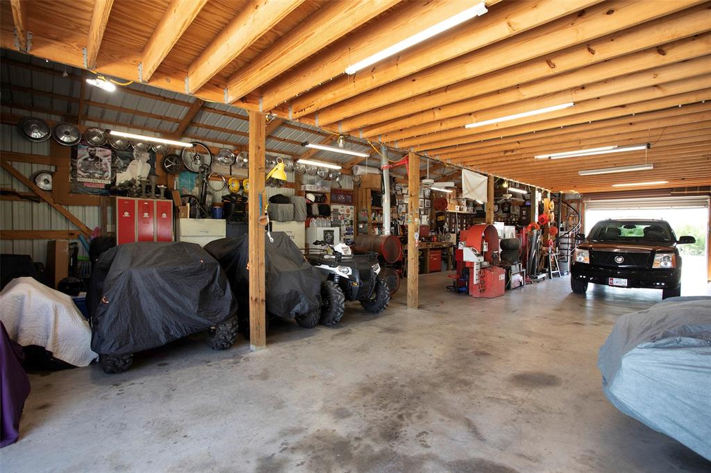 7060 Hells Gate Loop Strawn, TX 76475 - Photo 29 of 40 Garage with a workshop area