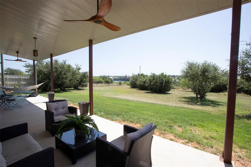 7060 Hells Gate Loop Strawn, TX 76475 - Photo 32 of 40 View of patio featuring ceiling fan and outdoor lounge area