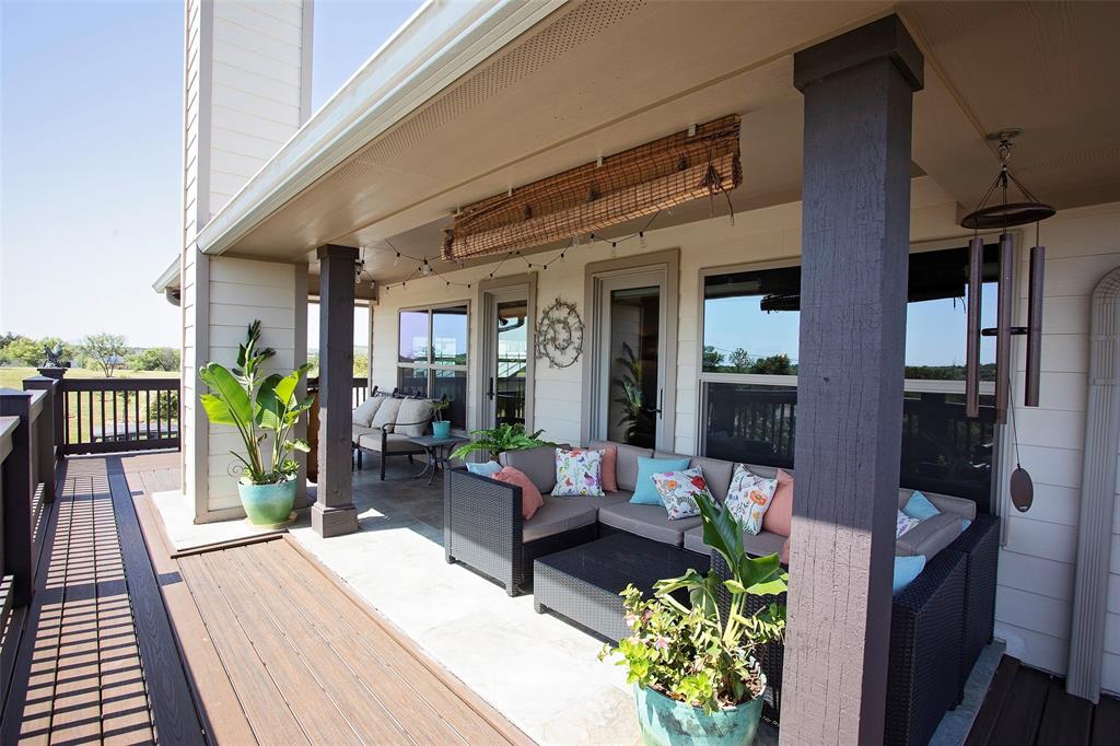 7060 Hells Gate Loop Strawn, TX 76475 - Photo 4 of 40 Wooden terrace with outdoor lounge area