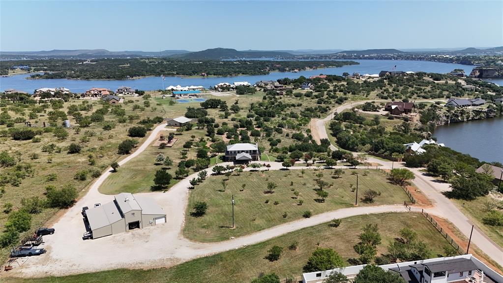 7060 Hells Gate Loop Strawn, TX 76475 - Photo 5 of 40 Aerial view of a water and mountain view