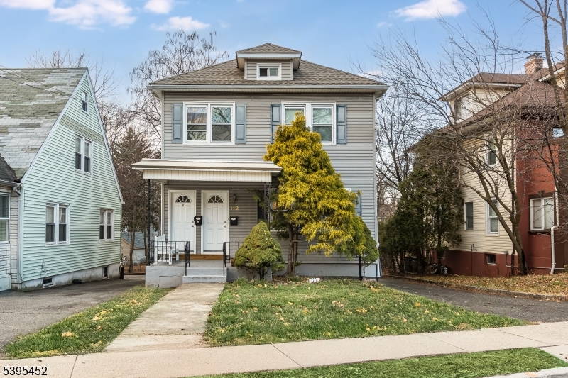 112 Pompton Avenue, Unit 1 Verona, NJ 07044 - Photo 1 of 25 a front view of a house with a yard
