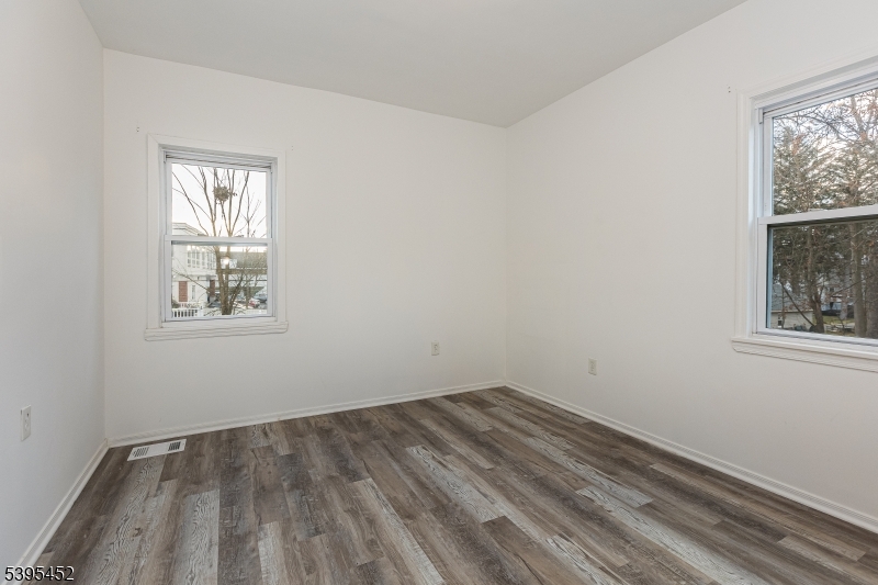 112 Pompton Avenue, Unit 1 Verona, NJ 07044 - Photo 11 of 25 an empty room with a window