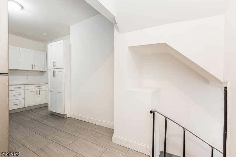 112 Pompton Avenue, Unit 1 Verona, NJ 07044 - Photo 16 of 25 a view of a kitchen with white cabinets