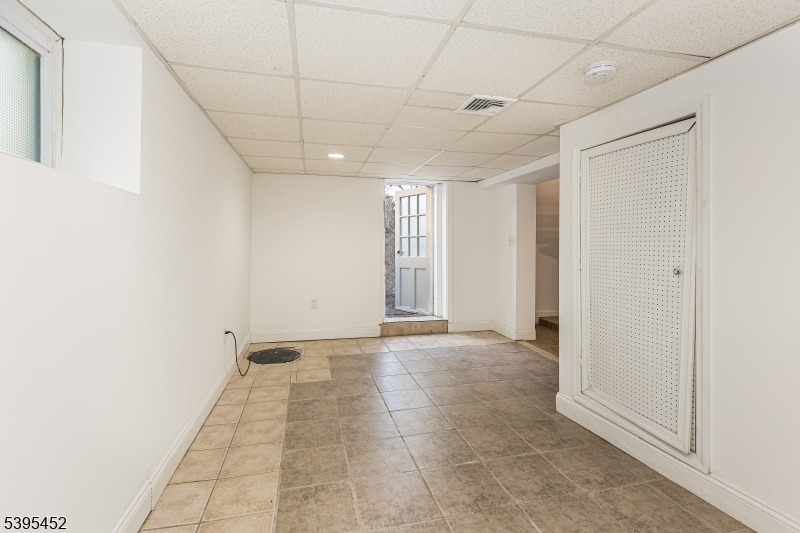 112 Pompton Avenue, Unit 1 Verona, NJ 07044 - Photo 20 of 25 a view of an empty room with a window