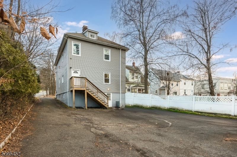 112 Pompton Avenue, Unit 1 Verona, NJ 07044 - Photo 24 of 25 a view of a house with a yard