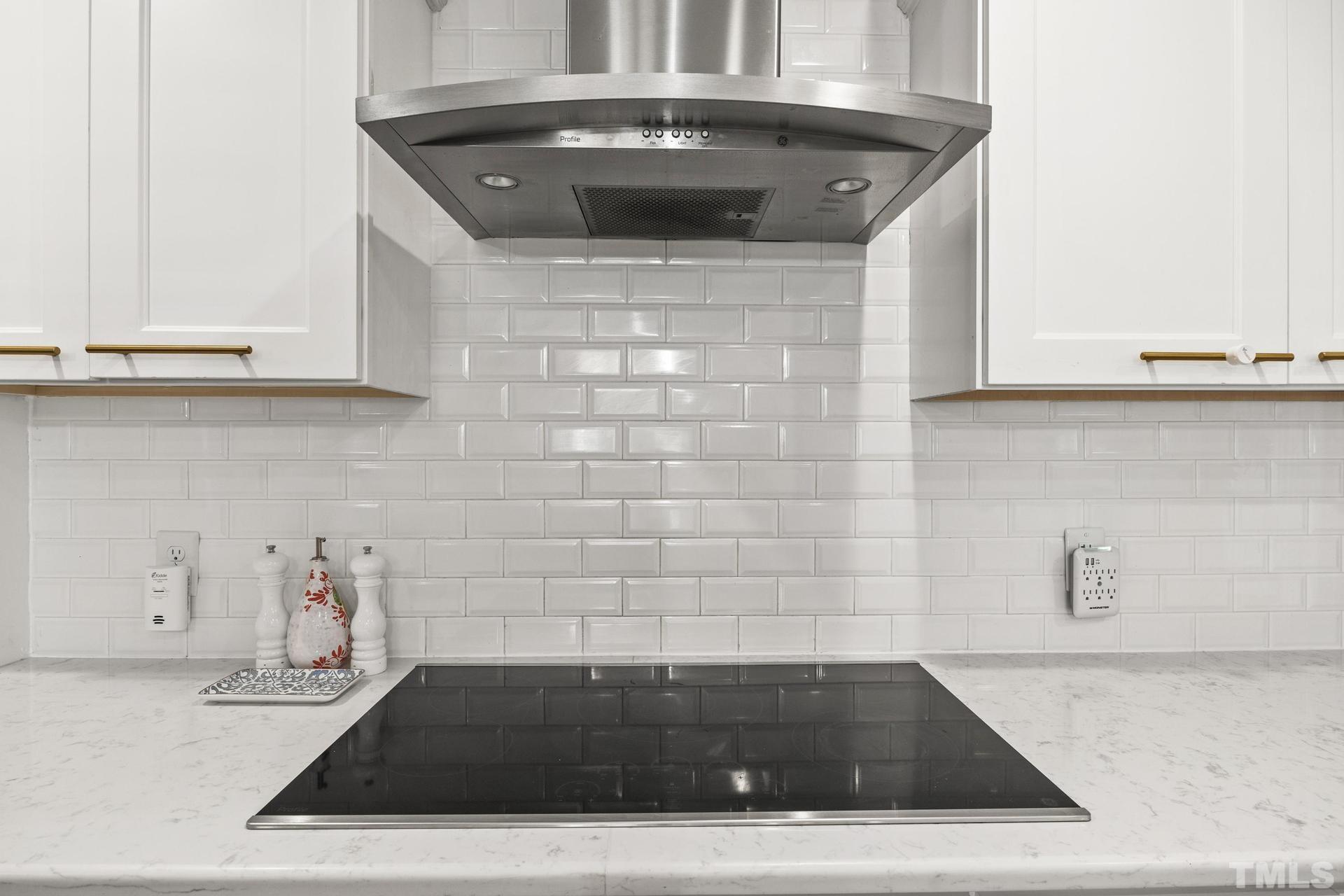 4816 Radcliff Road Raleigh, NC 27609 - Photo 14 of 52 a kitchen with granite countertop a sink and a stove