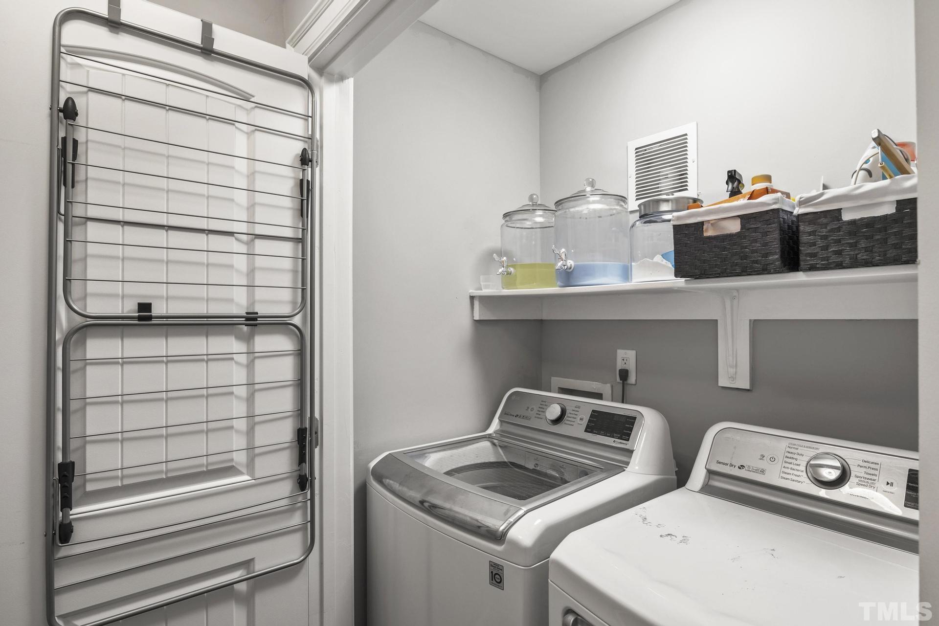 4816 Radcliff Road Raleigh, NC 27609 - Photo 25 of 52 a utility room with washer and dryer