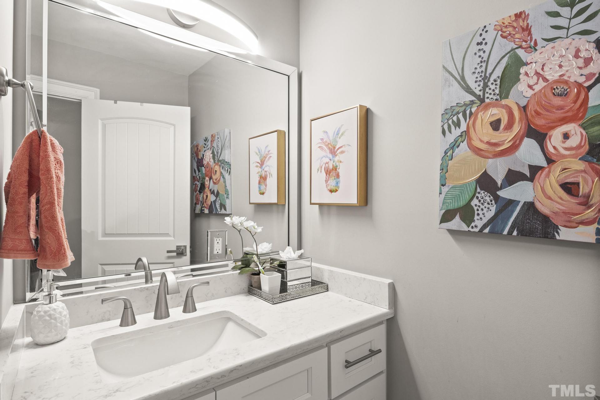 4816 Radcliff Road Raleigh, NC 27609 - Photo 26 of 52 a bathroom with a sink and a mirror