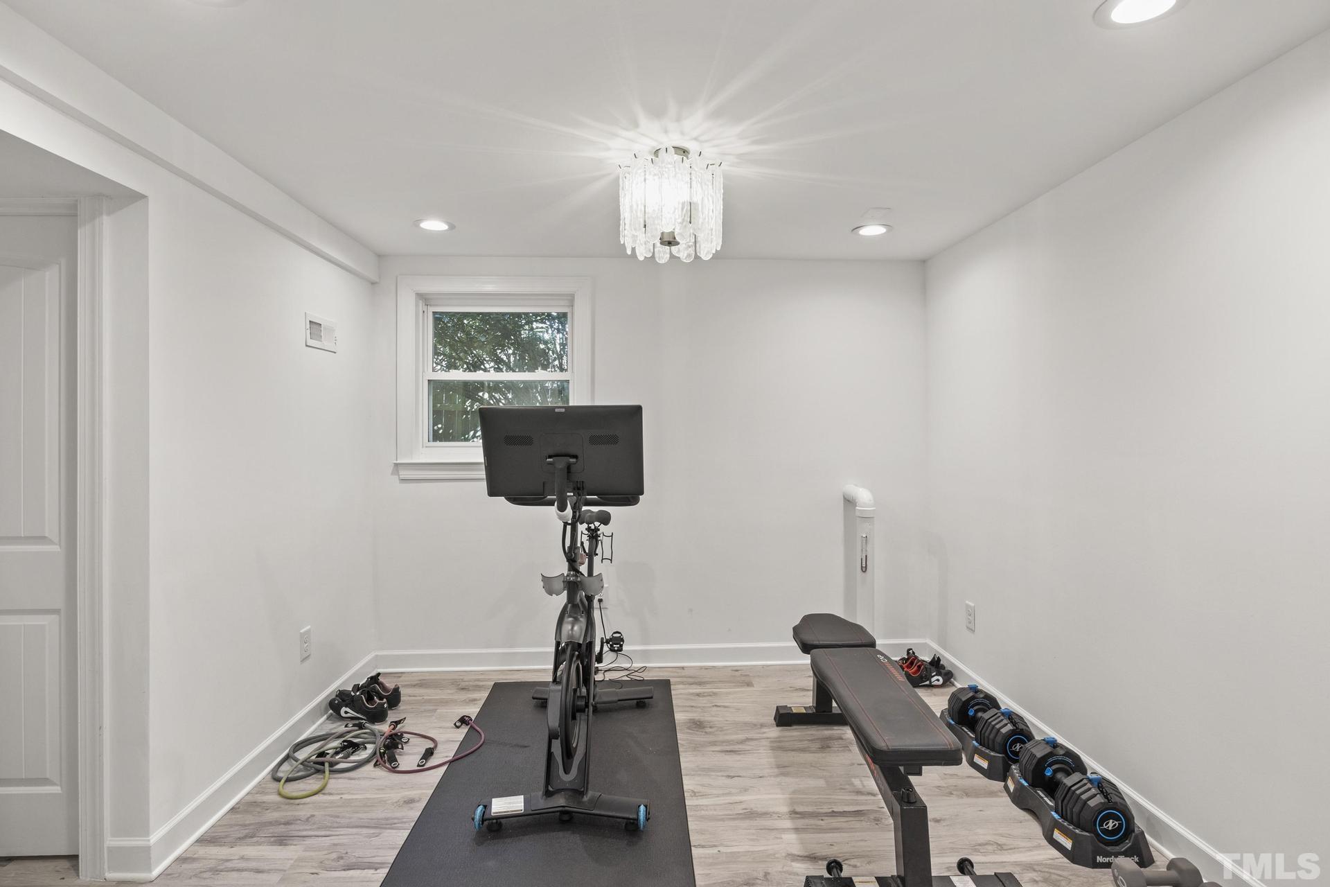 4816 Radcliff Road Raleigh, NC 27609 - Photo 37 of 52 a view of a room with gym equipment