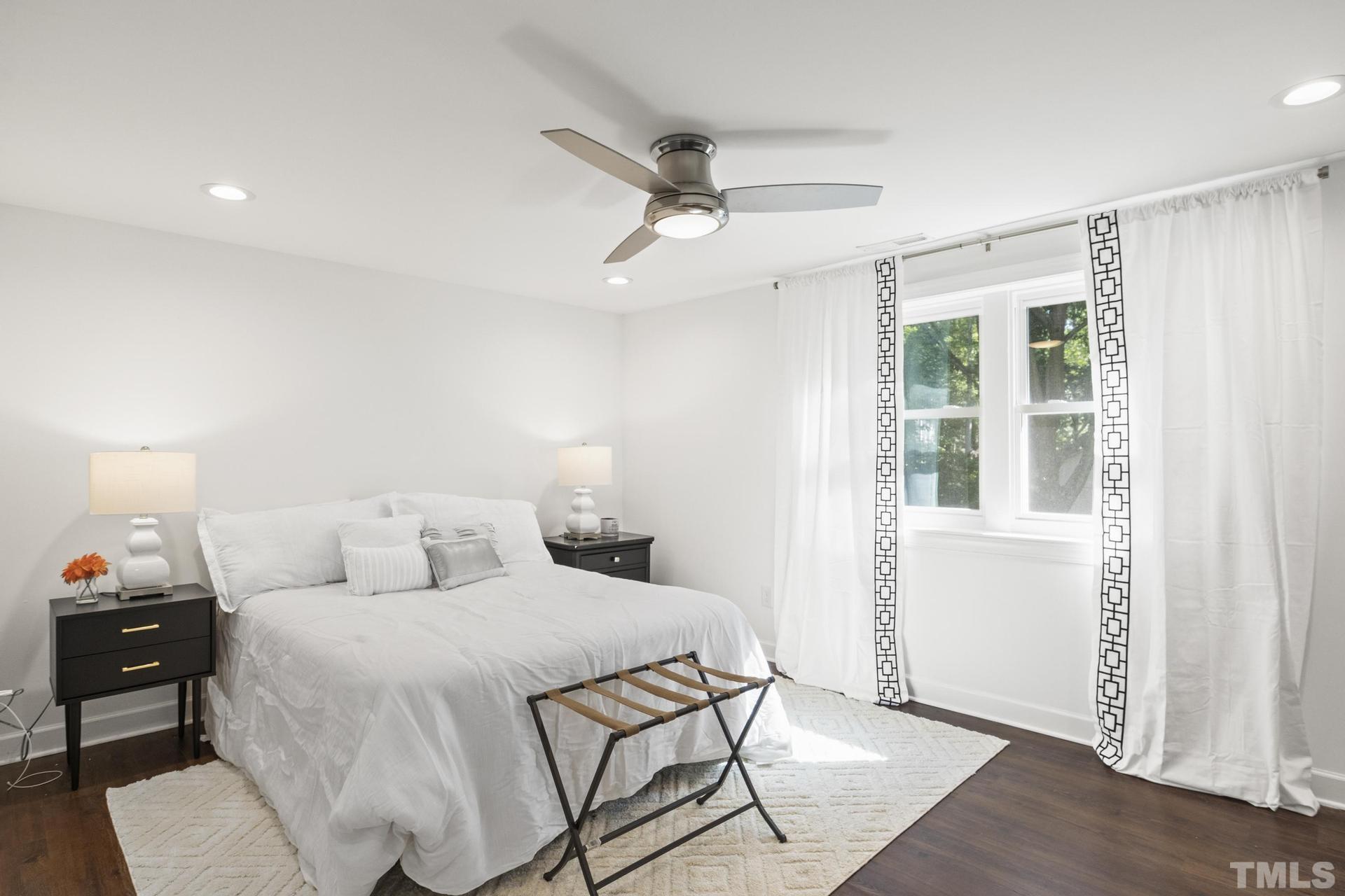 4816 Radcliff Road Raleigh, NC 27609 - Photo 39 of 52 a bedroom with a bed and a window