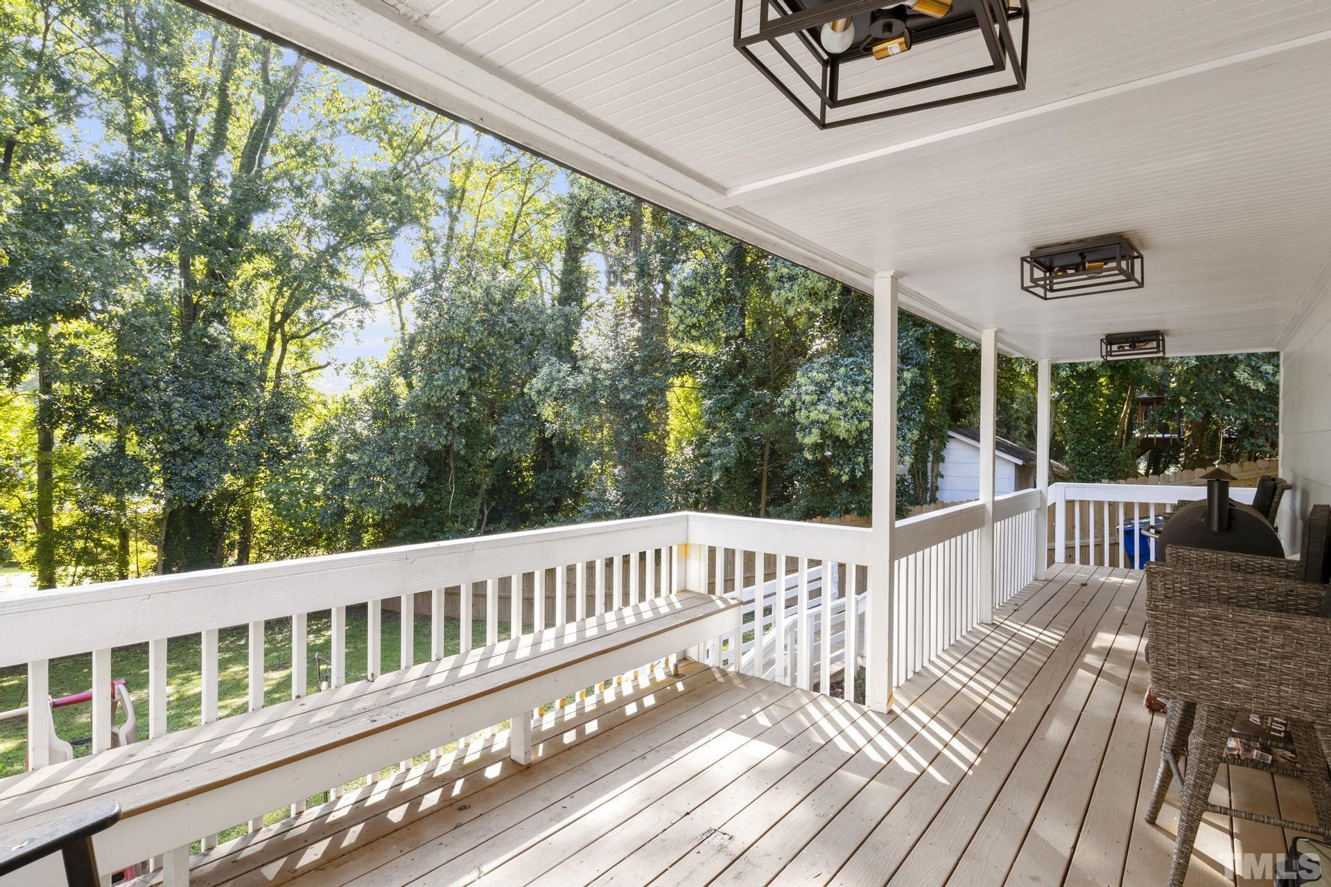 4816 Radcliff Road Raleigh, NC 27609 - Photo 43 of 52 a view of a balcony with wooden floor