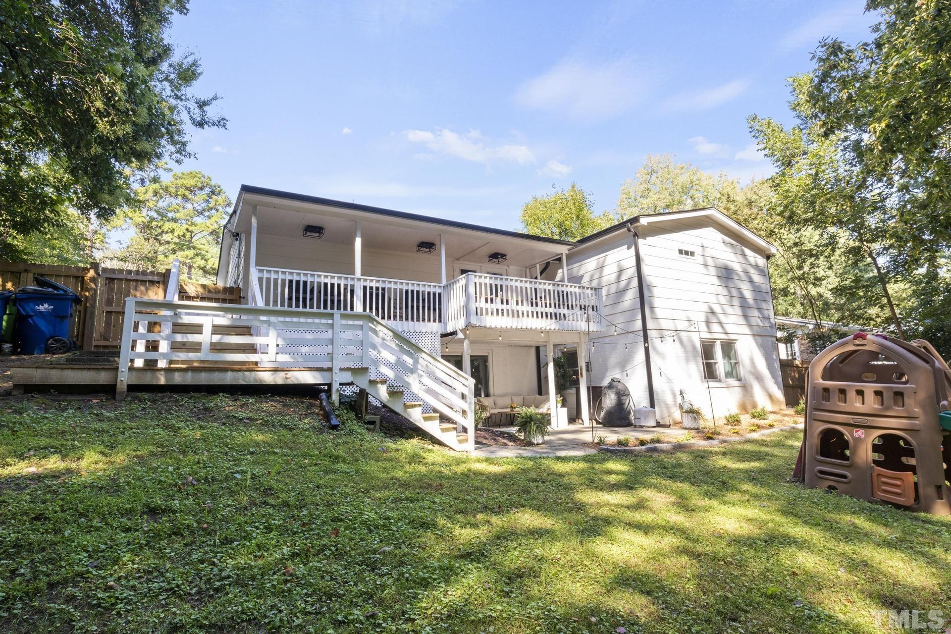 4816 Radcliff Road Raleigh, NC 27609 - Photo 45 of 52 a front view of a house with garden