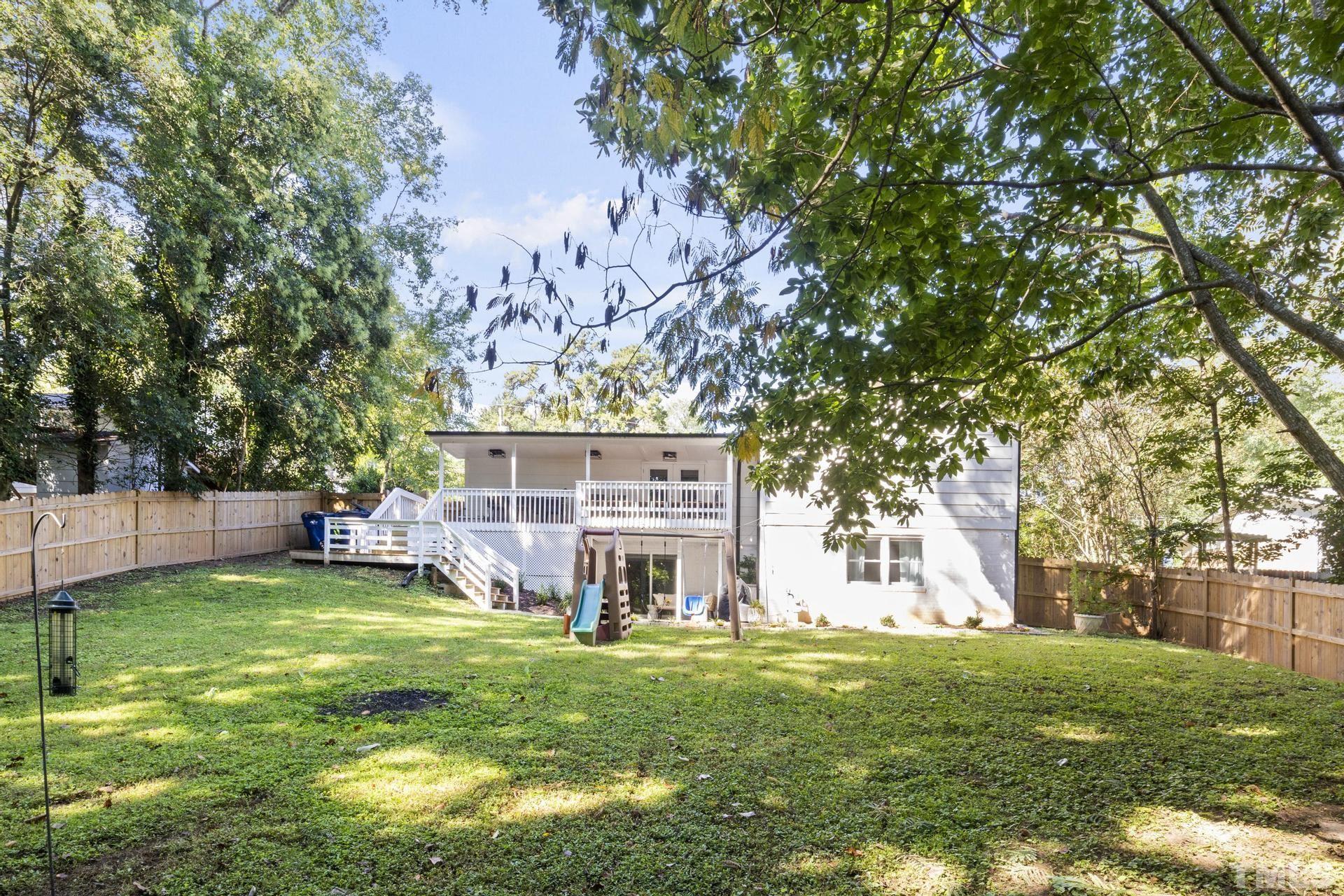 4816 Radcliff Road Raleigh, NC 27609 - Photo 47 of 52 a view of a house with a big yard and a large tree