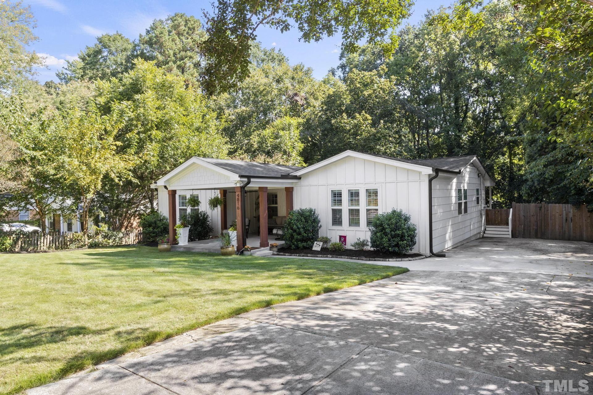 4816 Radcliff Road Raleigh, NC 27609 - Photo 50 of 52 a front view of a house with a yard
