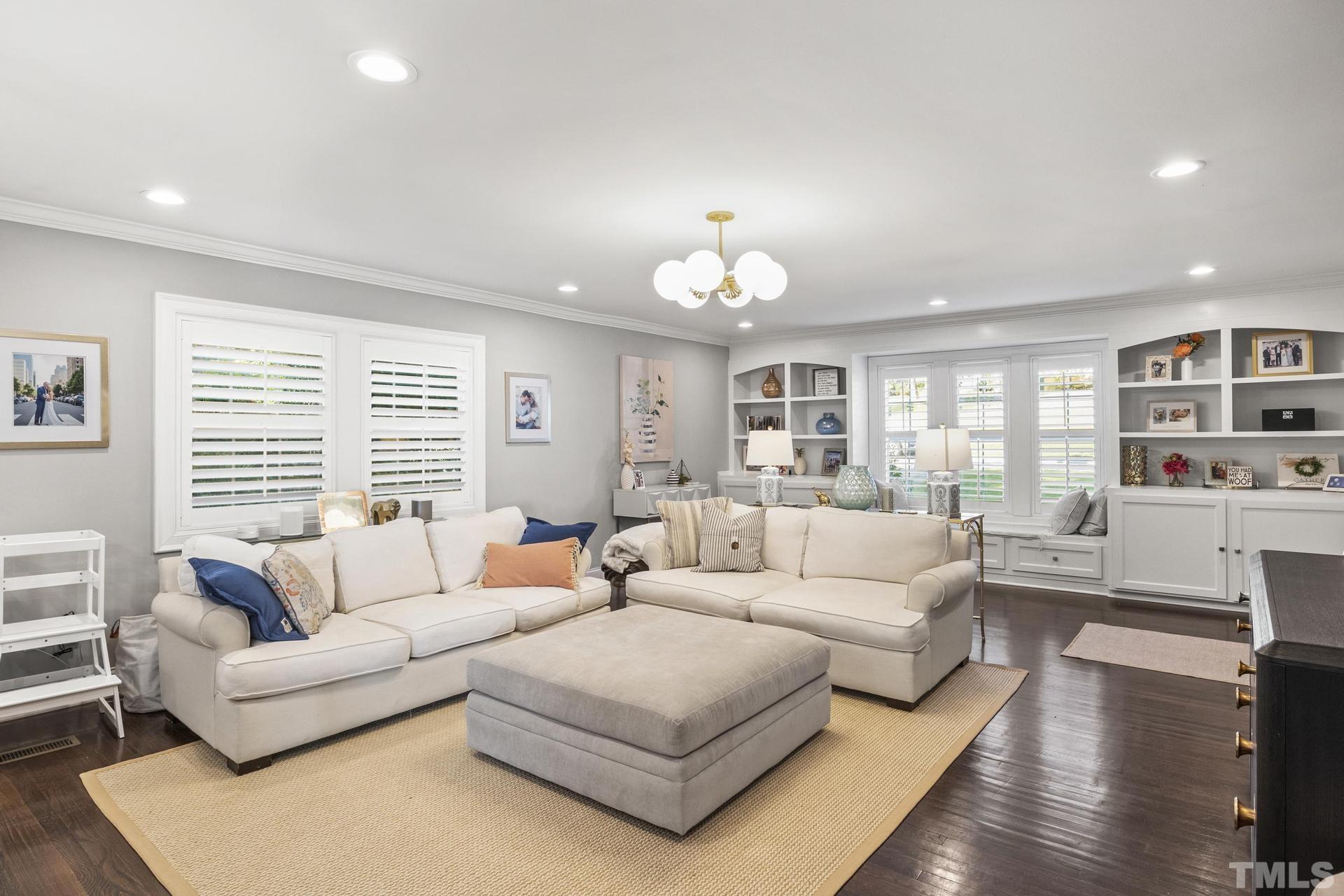 4816 Radcliff Road Raleigh, NC 27609 - Photo 10 of 52 a living room with furniture and a wooden floor