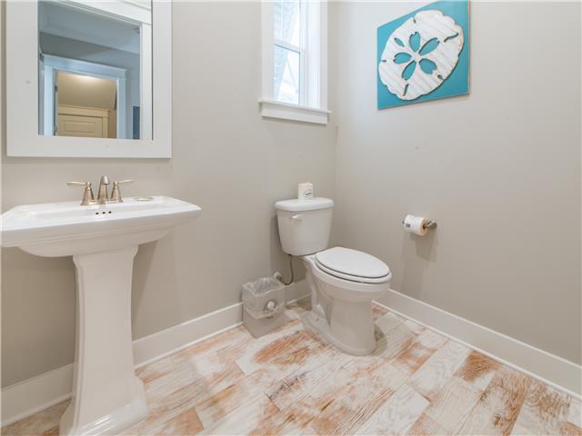 138 East E Pine, Unit A Inlet Beach, FL 32461 - Photo 10 of 48 a bathroom with a sink toilet and mirror