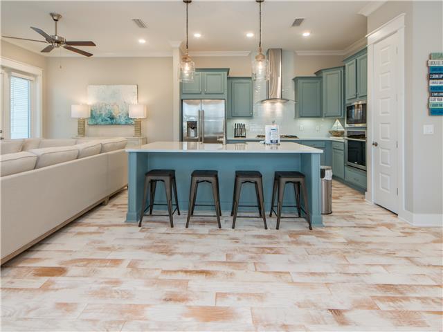 138 East E Pine, Unit A Inlet Beach, FL 32461 - Photo 11 of 48 a large kitchen with a table and chairs