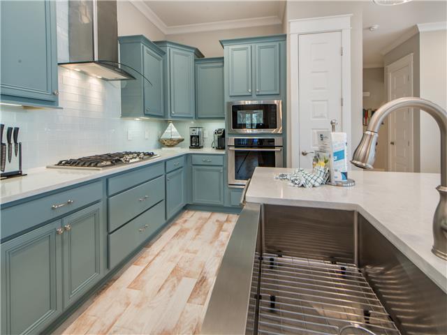 138 East E Pine, Unit A Inlet Beach, FL 32461 - Photo 14 of 48 a kitchen with stainless steel appliances a stove sink and cabinets