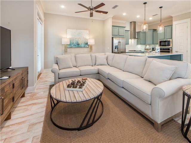 138 East E Pine, Unit A Inlet Beach, FL 32461 - Photo 15 of 48 a living room with furniture a large window and a chandelier