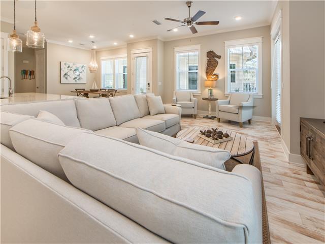 138 East E Pine, Unit A Inlet Beach, FL 32461 - Photo 17 of 48 a living room with furniture white walls and chandelier