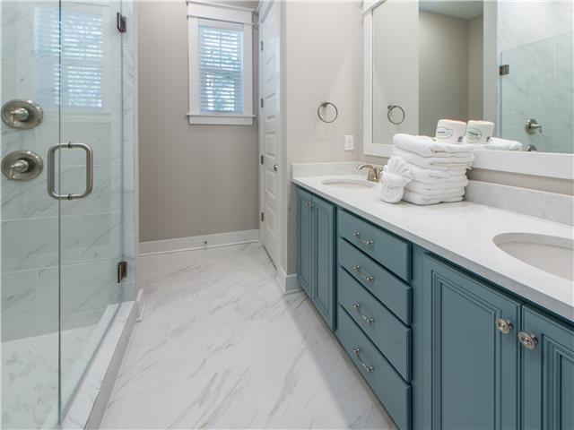 138 East E Pine, Unit A Inlet Beach, FL 32461 - Photo 18 of 48 a bathroom with a double vanity sink and mirror