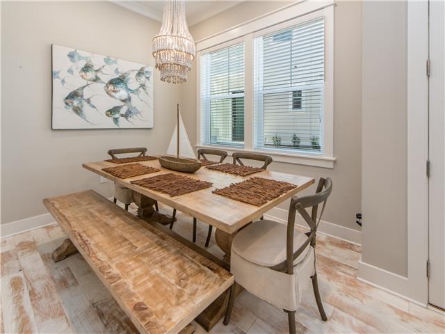 138 East E Pine, Unit A Inlet Beach, FL 32461 - Photo 2 of 48 a living room with a table and a window