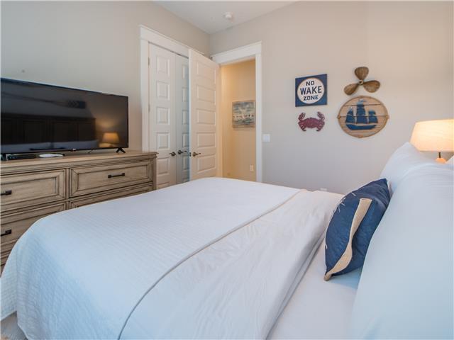 138 East E Pine, Unit A Inlet Beach, FL 32461 - Photo 8 of 48 a bedroom with a bed and a flat screen tv