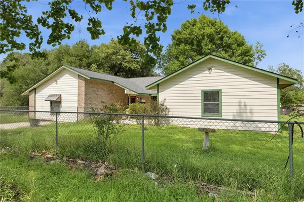 a view of a backyard of the house